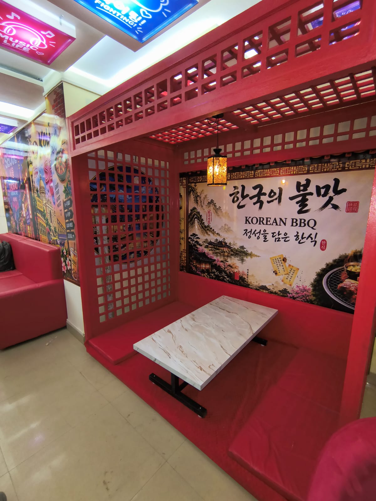 Red Korean BBQ seating at Tao Bao Cafe